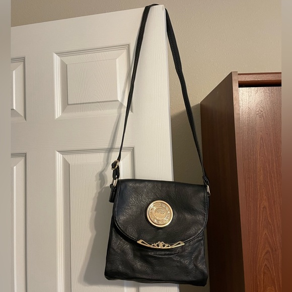 Black Crossbody Purse with Gold colored accents. - Picture 2 of 10